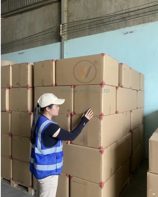 Checking packed loofah cartons in the warehouse before a trial shipment